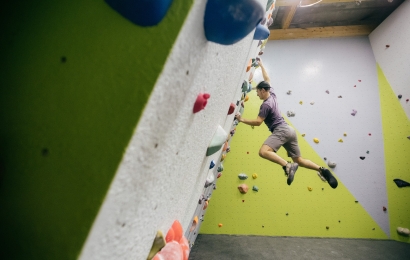 Person rock climbing indoors