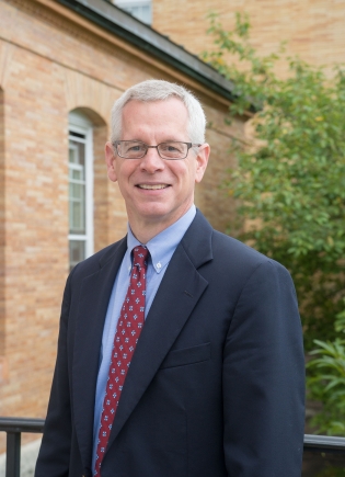 A portrait of Duane A. Compton, professor of biochemistry, who was named the interim dean of the Geisel School of Medicine.