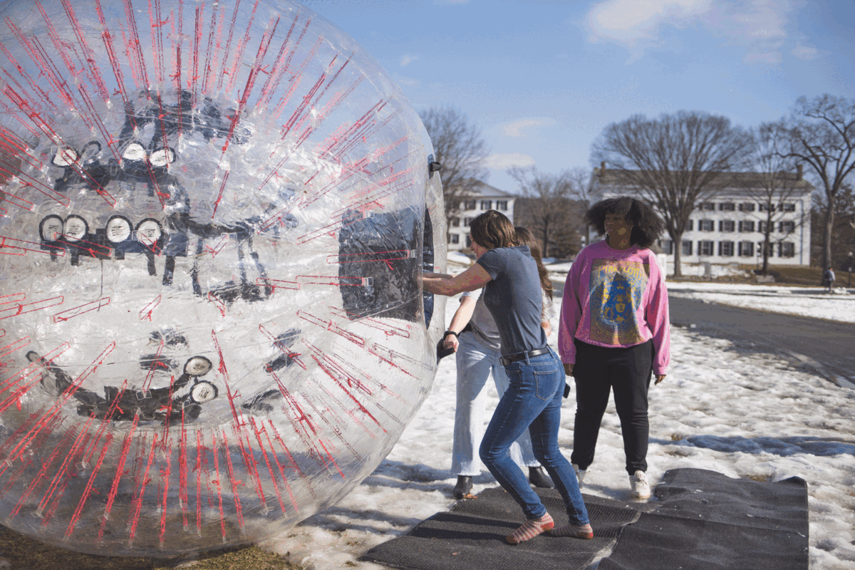 Student leaping into a giant Zorb.