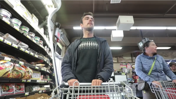 Man pushing grocery cart