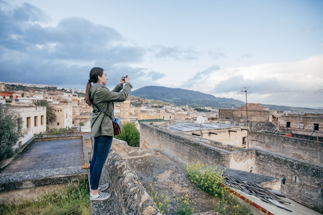 Marlene Arias taking a photo of the city