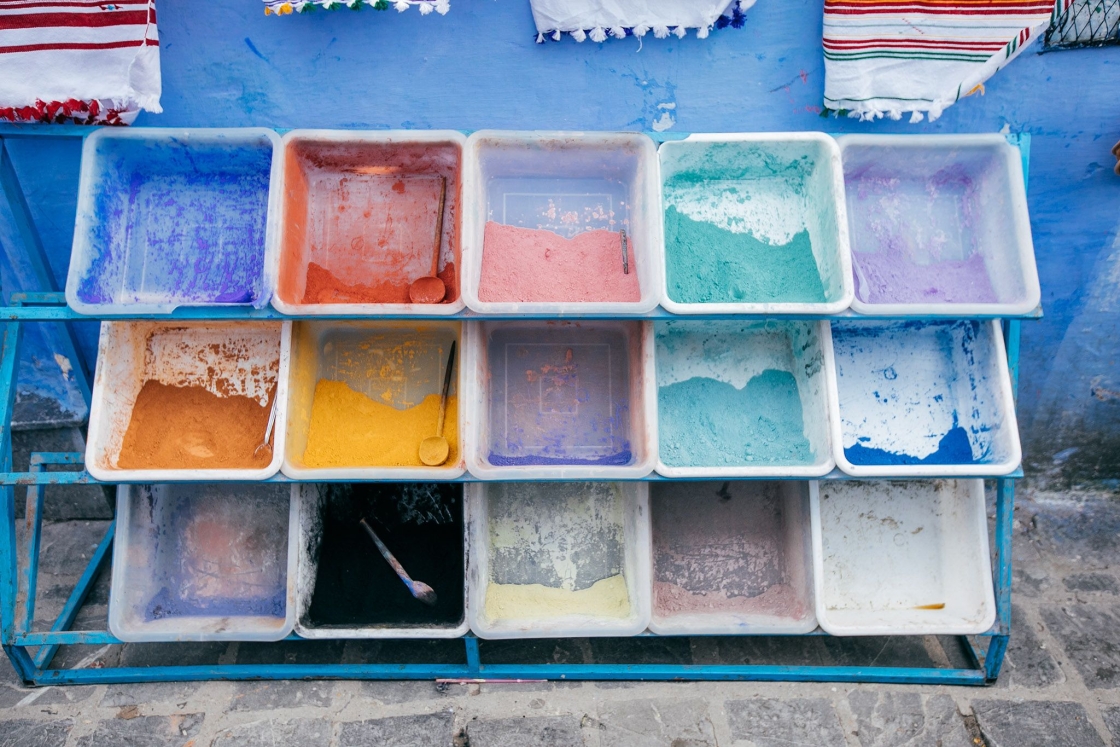 Buckets of colorful powder