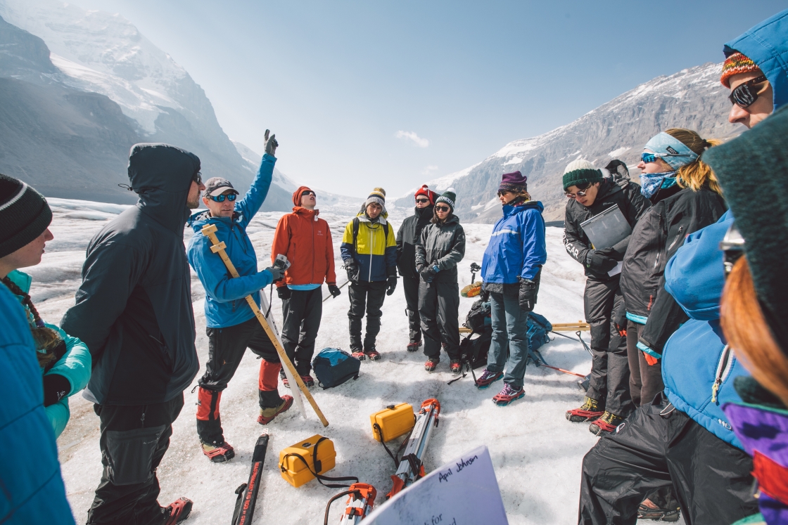 Associate Professor Erich Osterberg teaches surveying techniques on the Athabasca Glacier in Banff National Park.