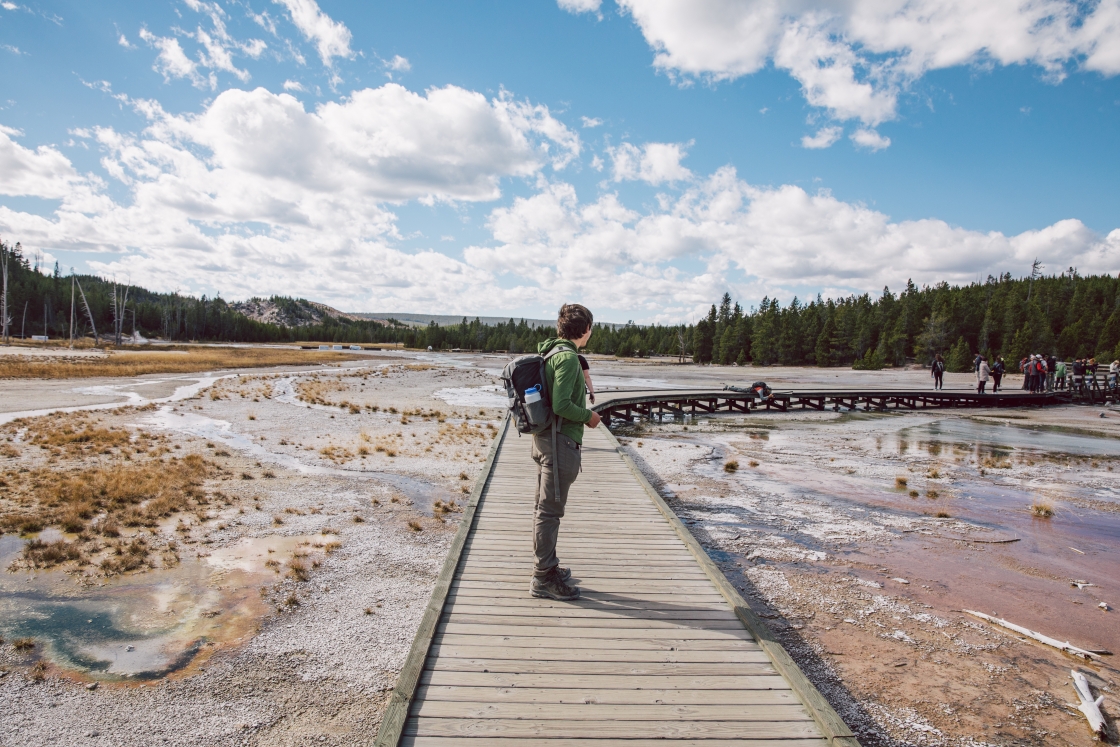 Zachary Berkow ’20 stands on the wooden walkways in Yellowstone National Park.