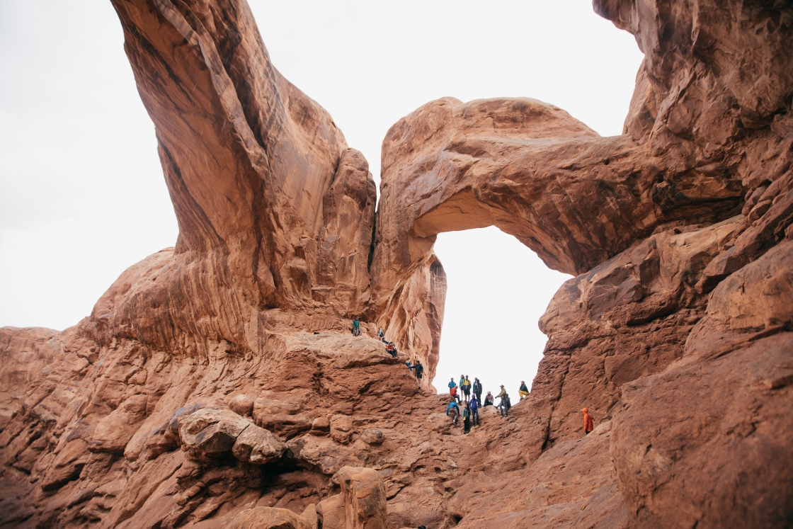 Students climbing the rocks in Arches National Park.