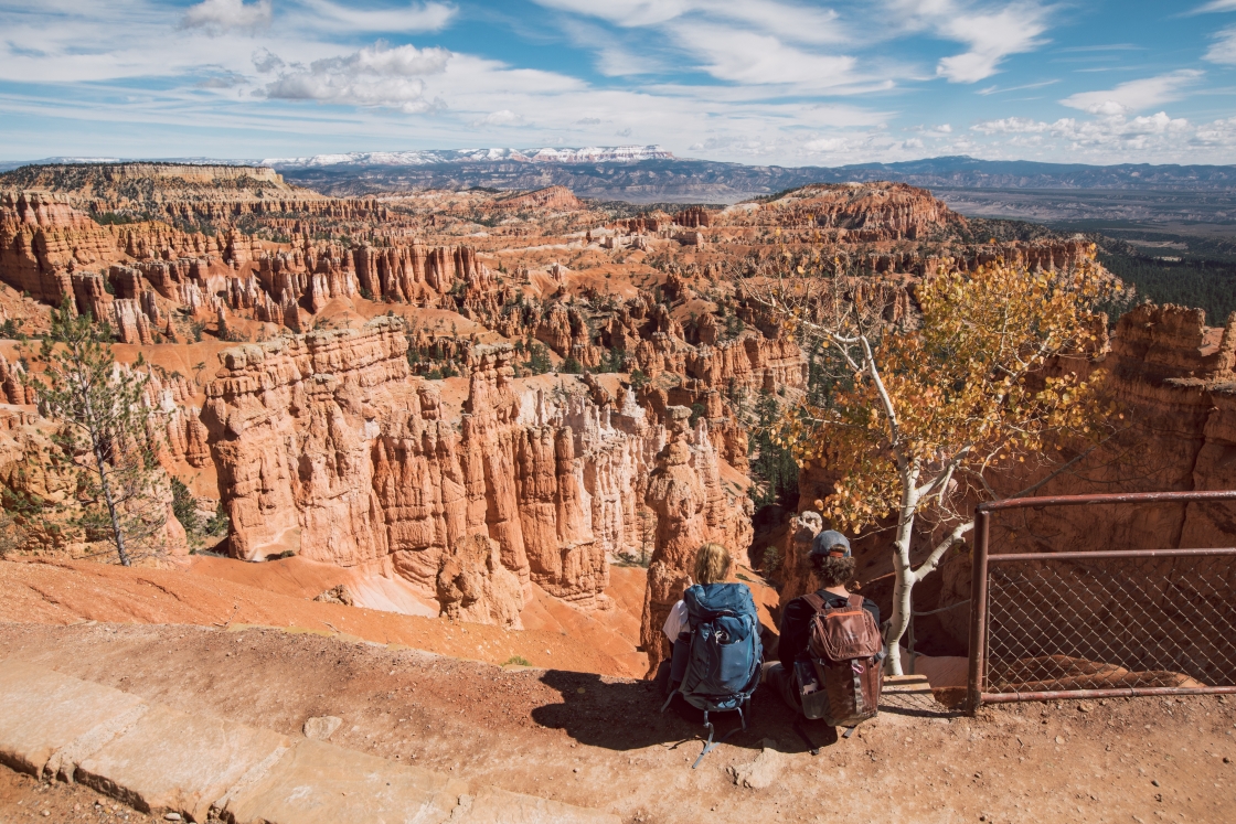 Two students sitting and admiring the views of Bryce Canyon National Park.