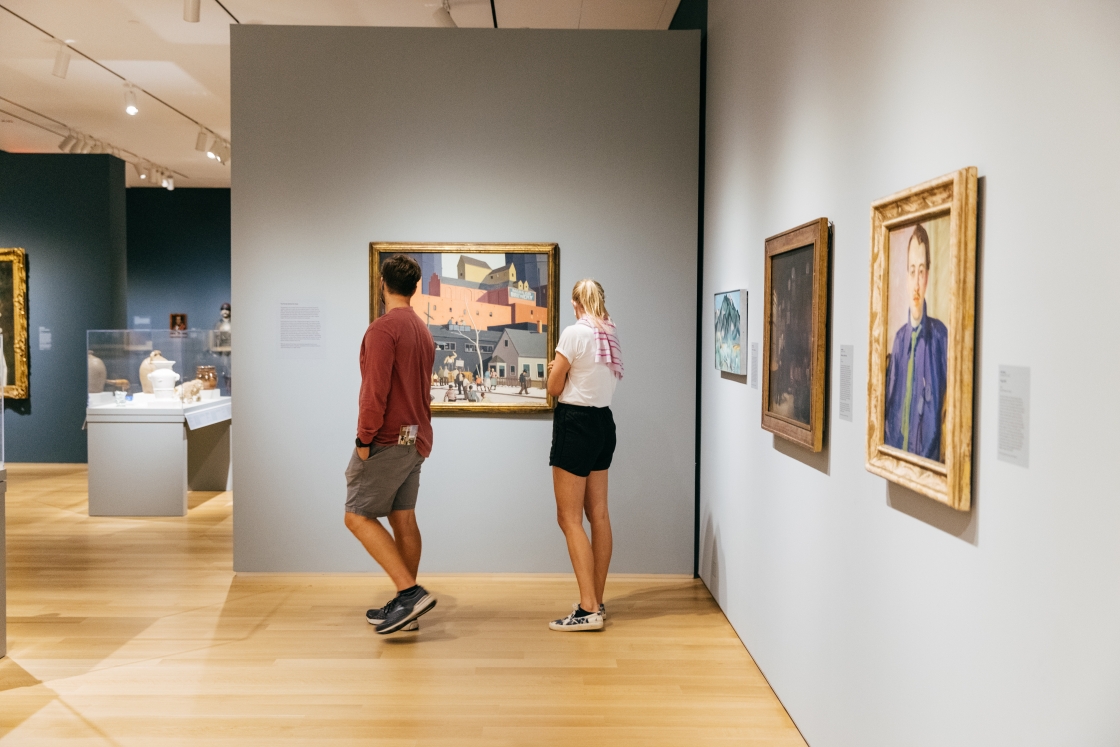 Two people look at art in the newly reopened Hood Museum