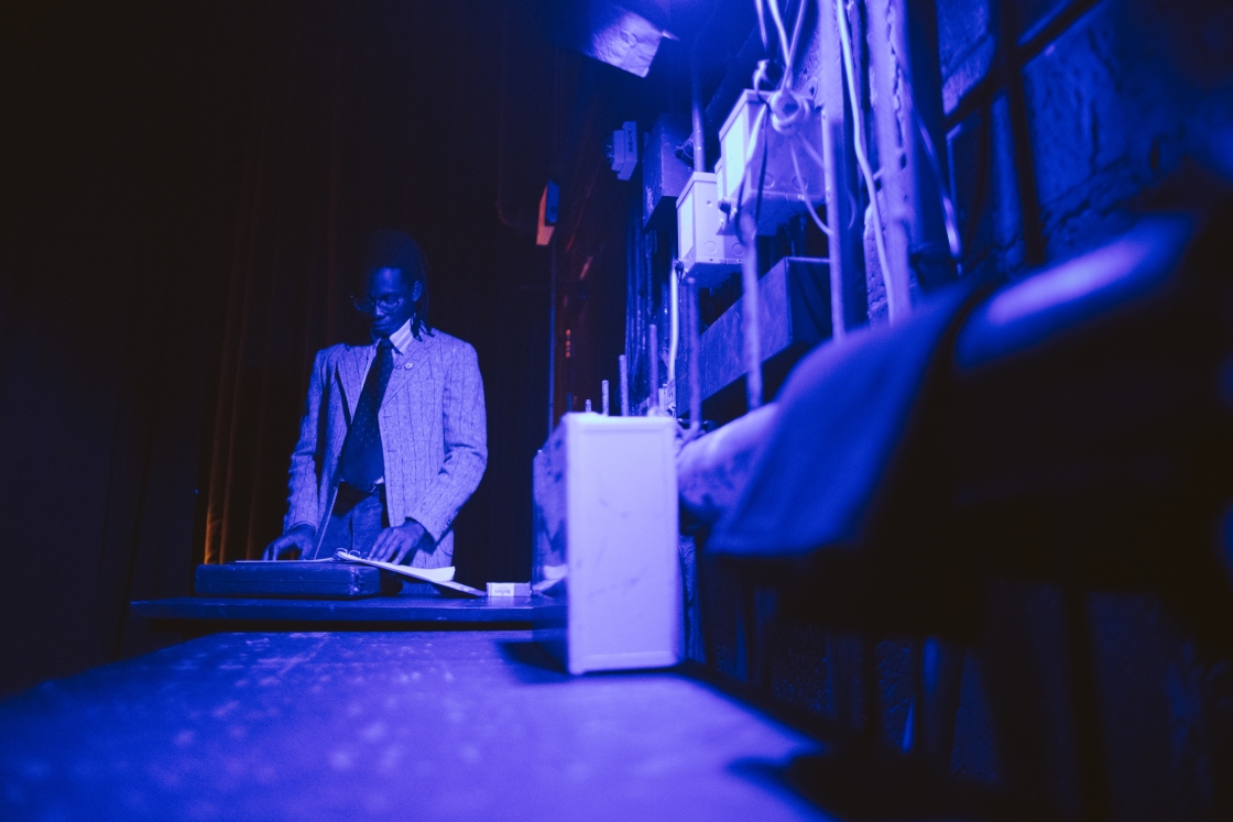 Man reading script backstage