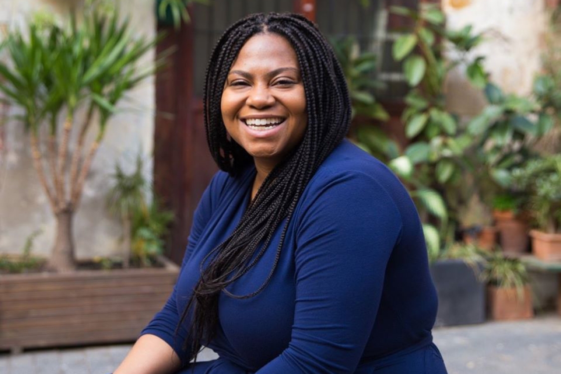 Portrait of Chloe Poston in a dark blue shirt