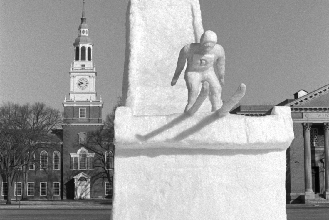 Snow sculpture of a ski jumper at the end of the jump