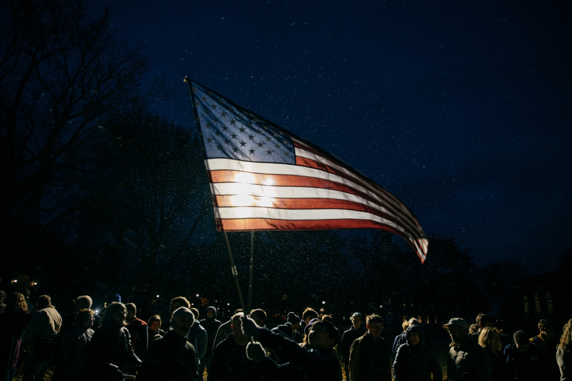 American flag raised at night