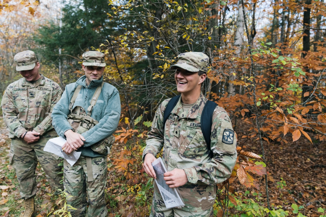 Three ROTC members smiling