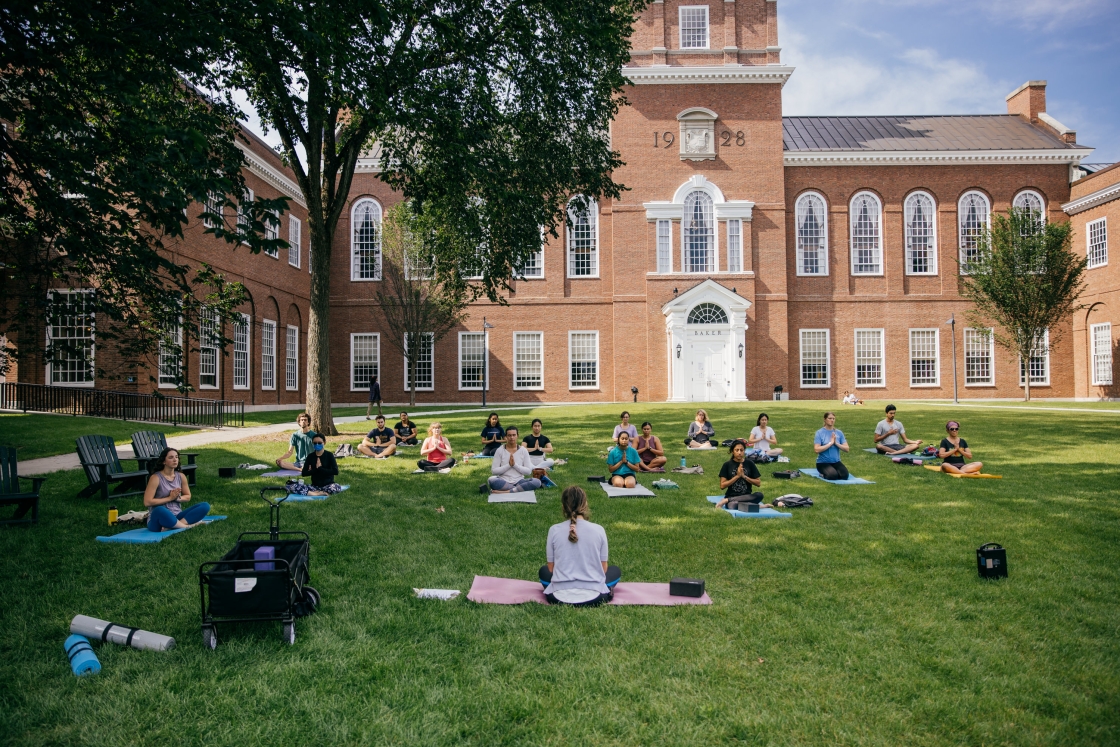 People doing yoga outside of Baker-Berry library