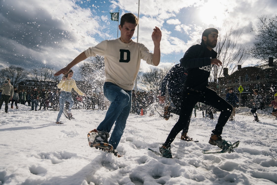 students racing in snowshoes