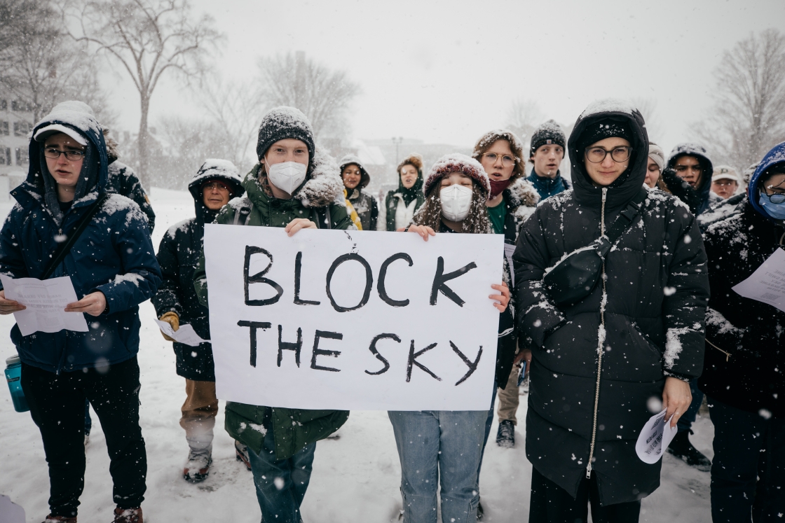 Students holding poster that reads &quot;block the sky&quot;