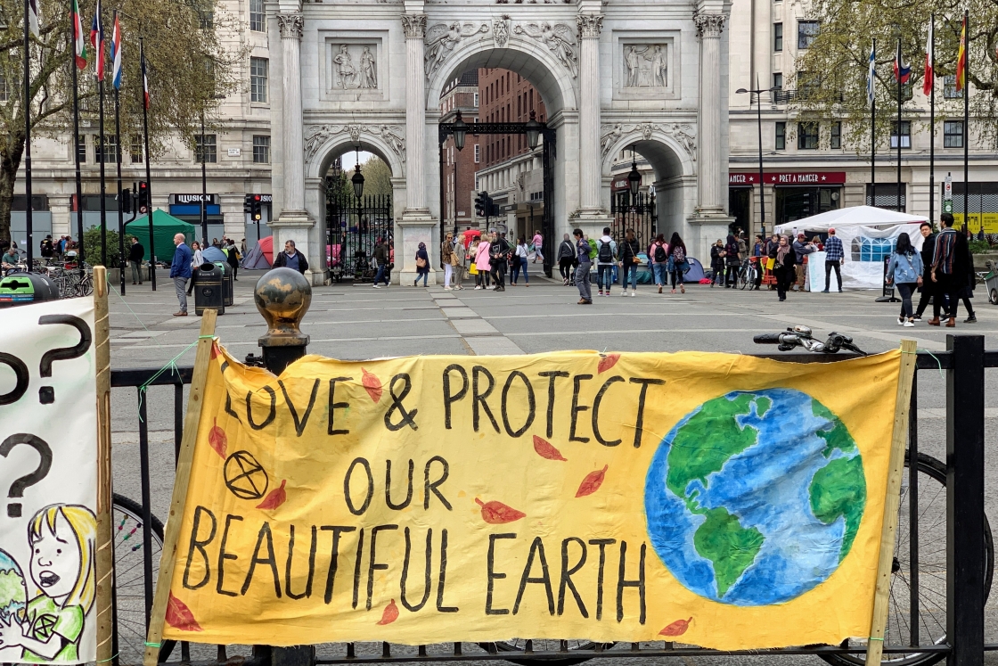 yellow banner that reads love and protect our beautiful earth