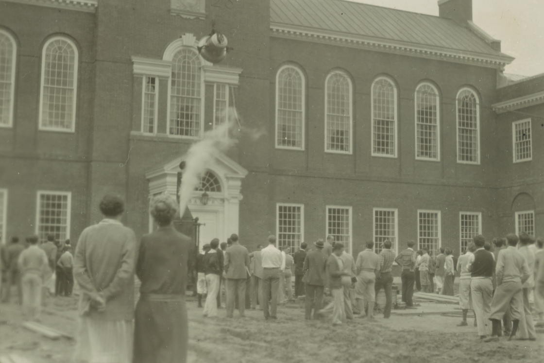 A bell being hoisted up to Baker tower