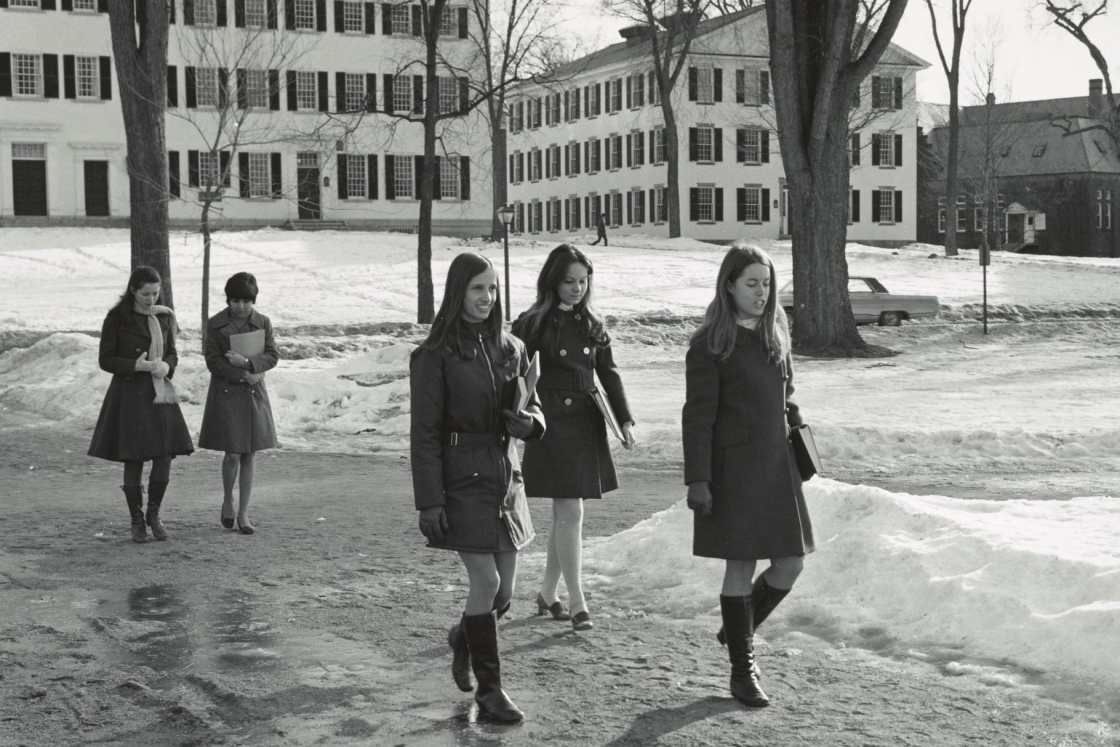 Women walking across the Green during the winter