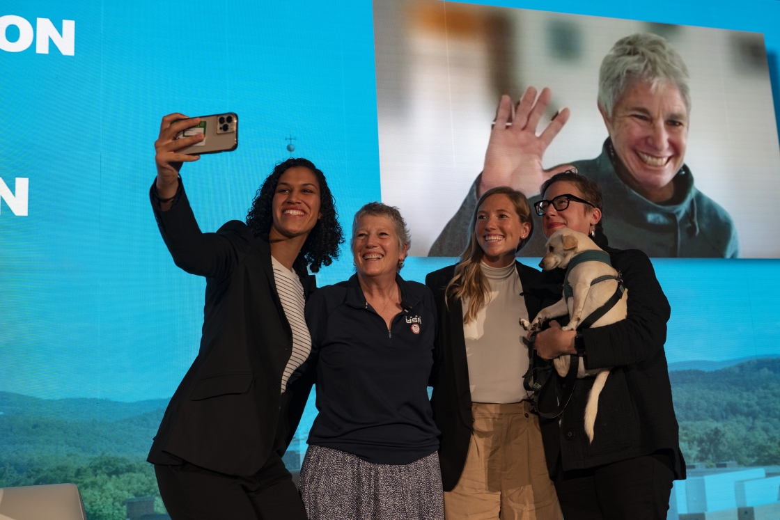 People take a selfie at the rededication of Dartmouth Hall