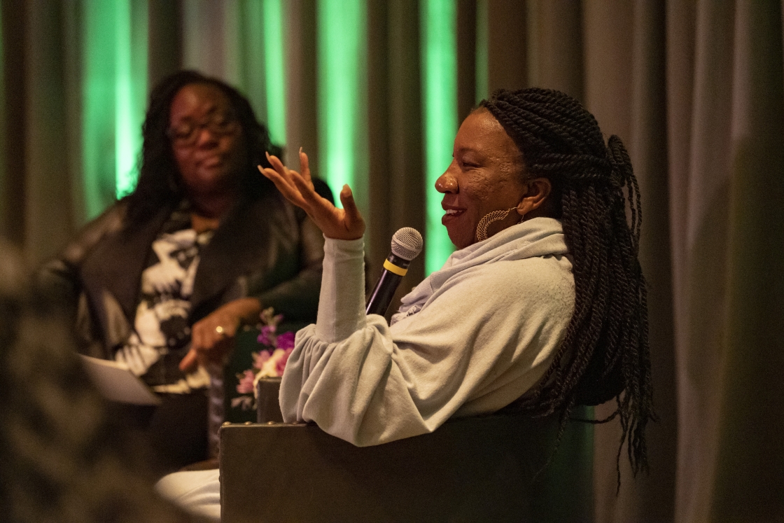 Tarana Burke speaking and Shontay Delalue in the background