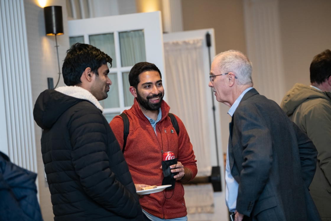 Phil Hanlon talking to two people at the Hanover inn