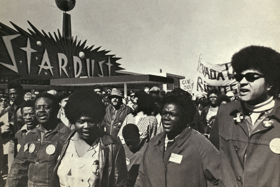 Ralph Abernathy, Ruby Duncan, and George Wiley hand in hand in the Operation Nevada crowd.