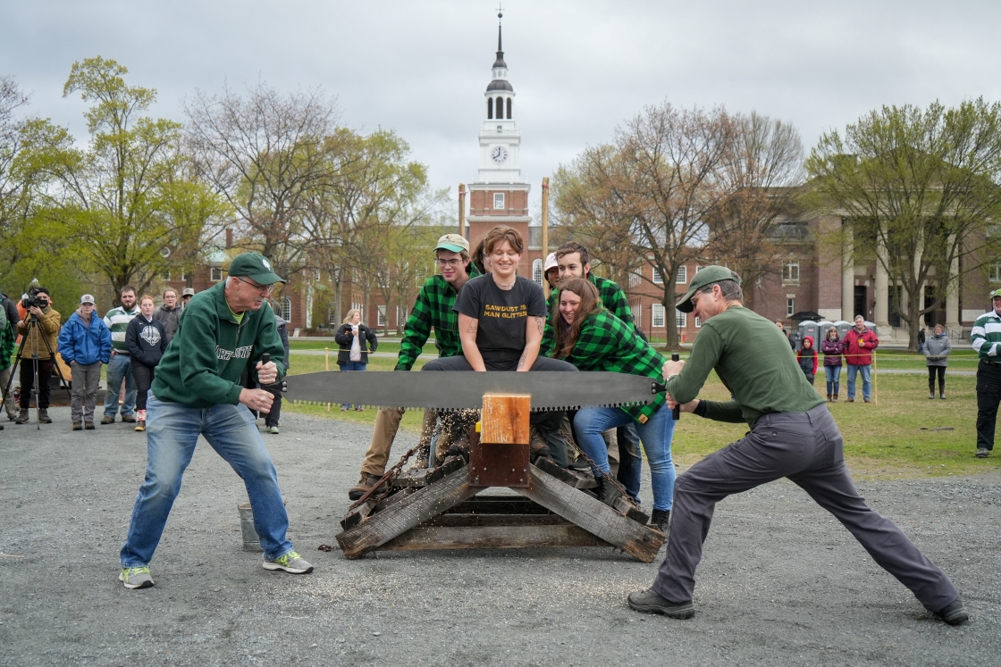 Phil Hanlon '77 and Dave Kotz '86 try their hand at using a crosscut saw