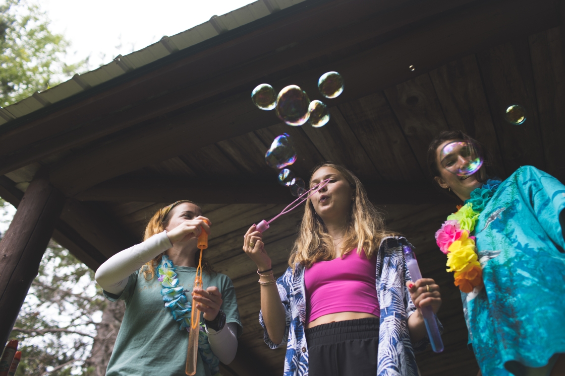 Students blow bubbles