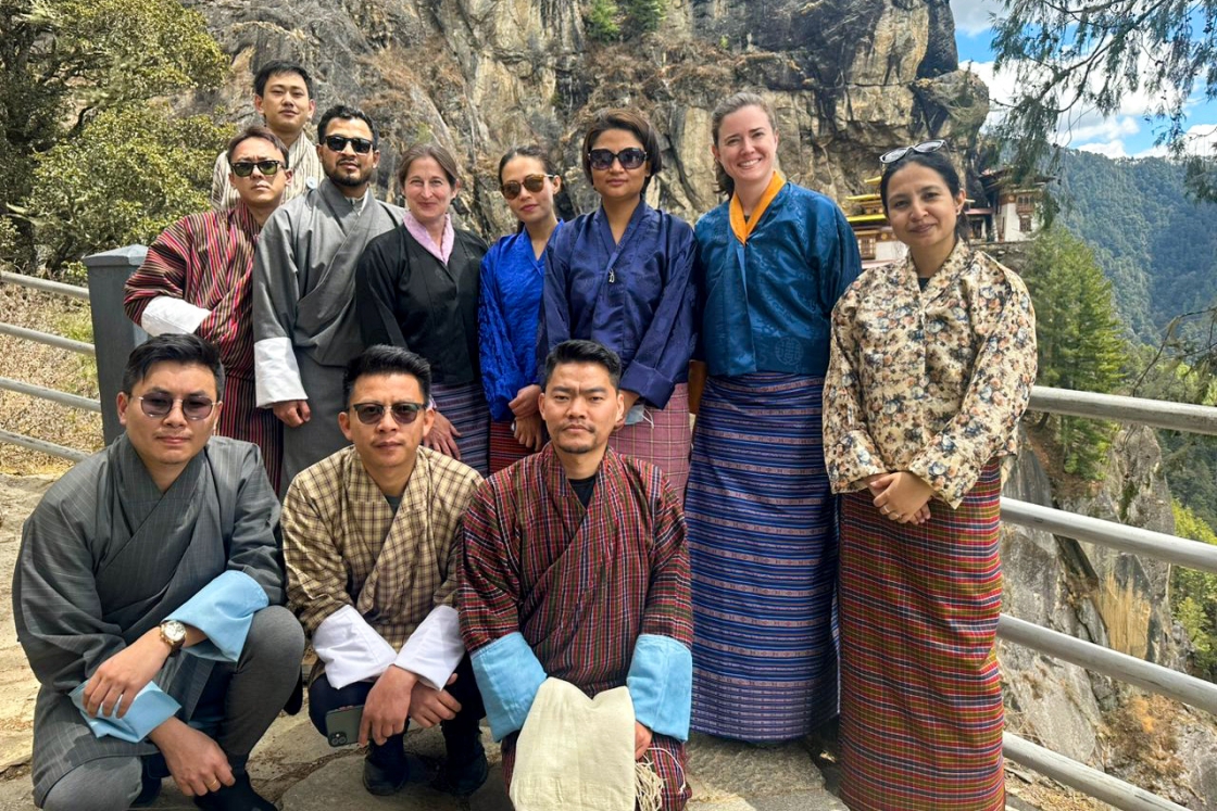 Melanie R. Watts and Kathleen S. White pose for a photo with Bhutanese colleagues