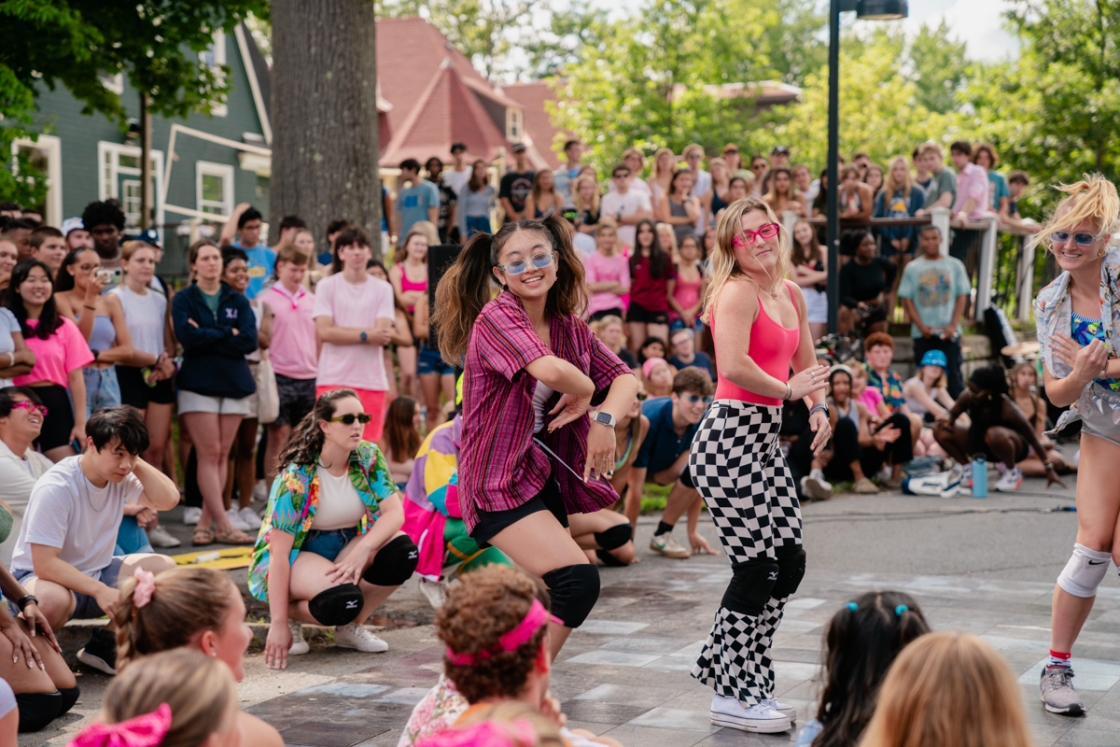 Students dancing in bright colored clothing