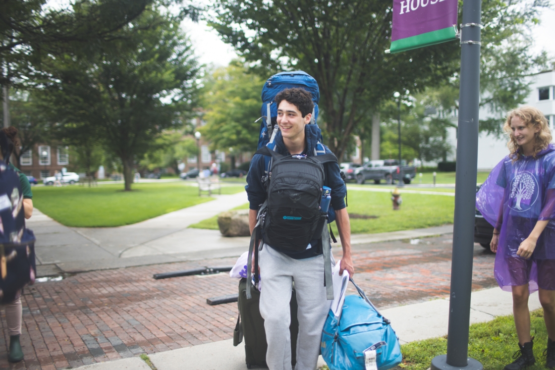 Incoming student carryies multiple bags