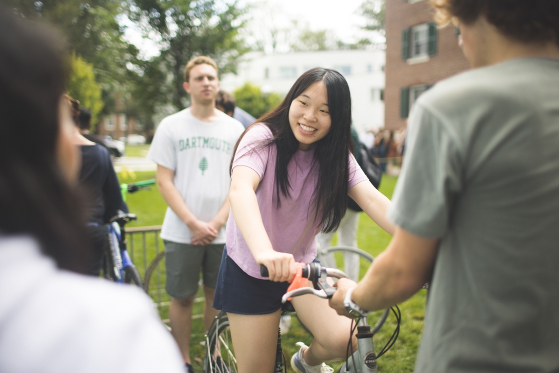 Incoming student tries out a bicycle
