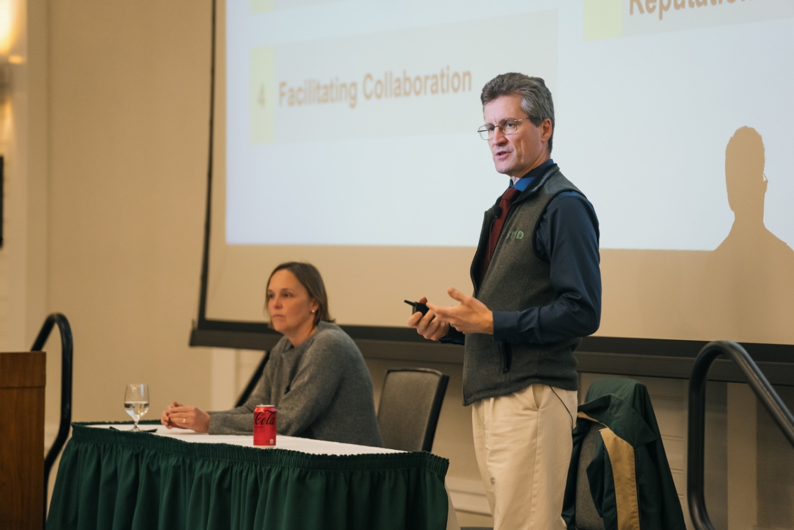 Provost David Kotz '86 and international studies professor Nina Pavcnik address faculty and staff.