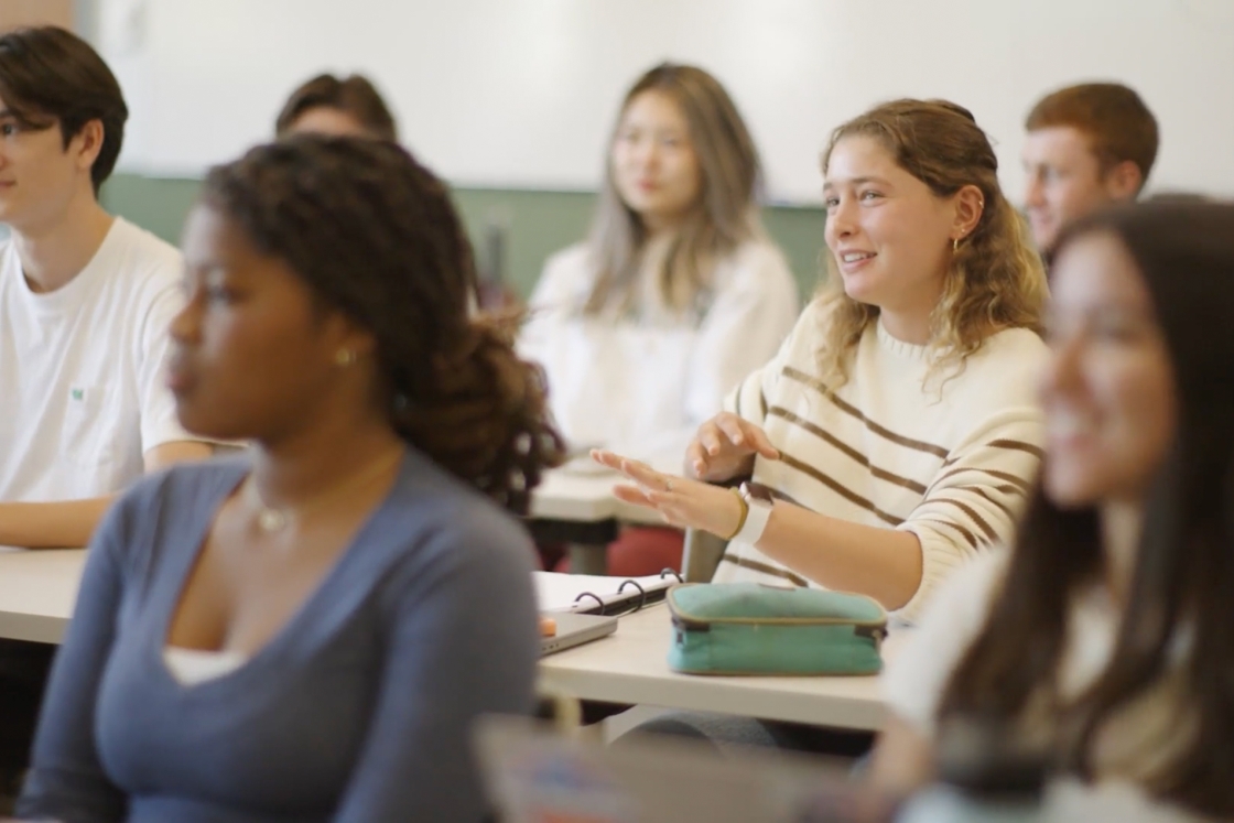 Student discusses topic in classroom