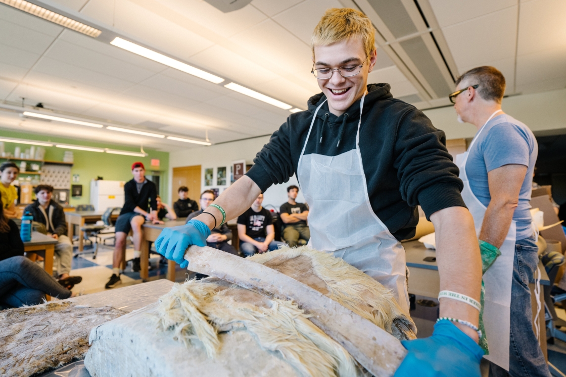 David Adams '26 tries his hand at parchment-making