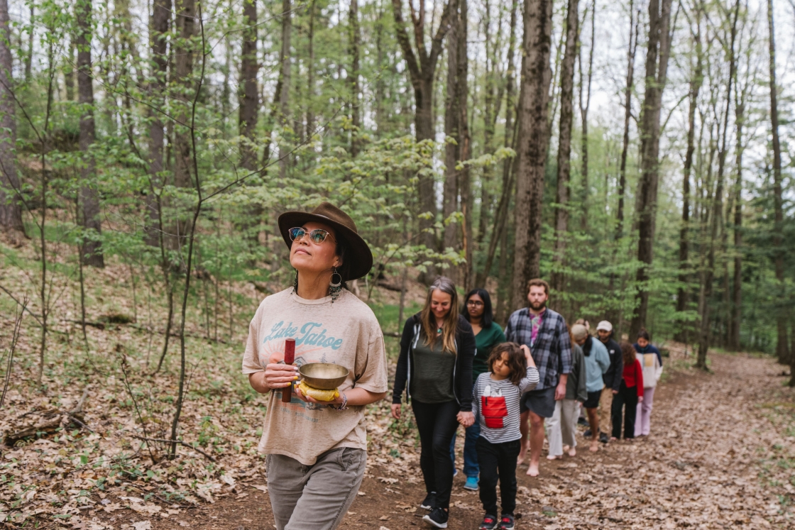 Luisa Lindsley leading a walk through the forest