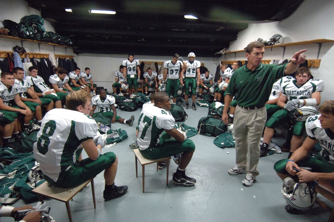 Buddy Teevens and football team in locker room