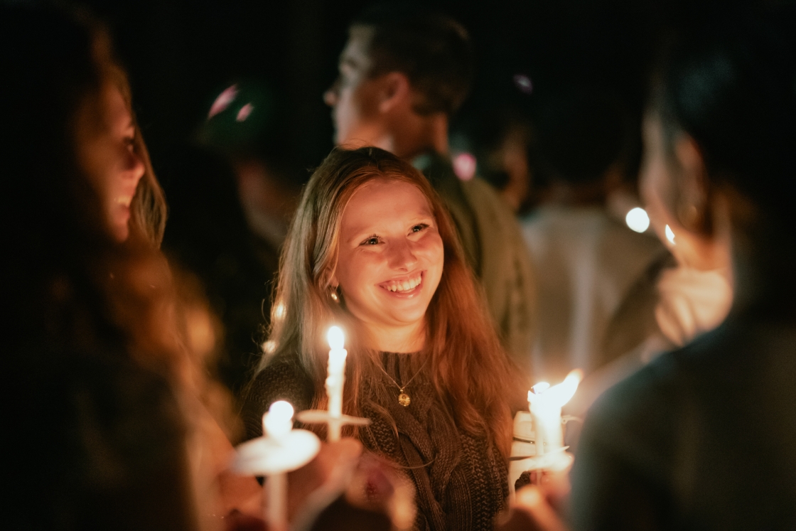 Students holding candles