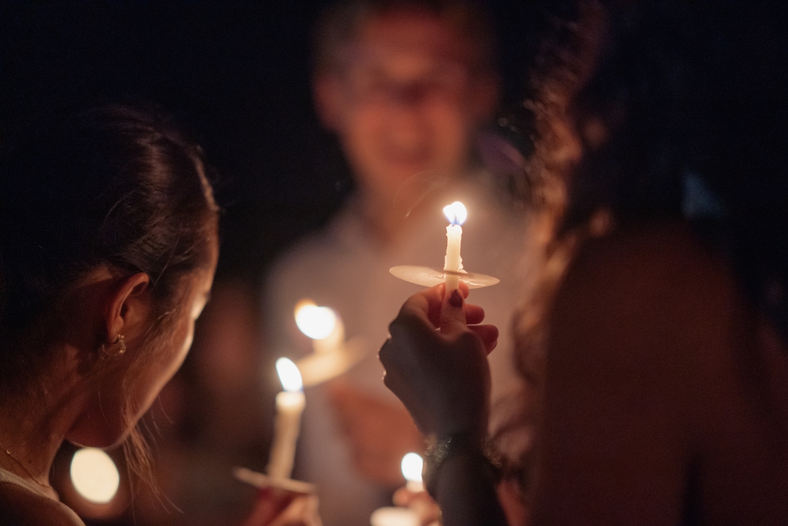 Students holding candles