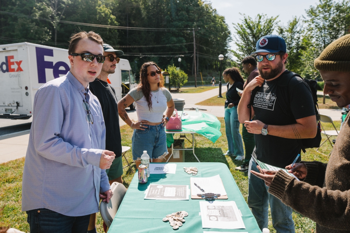 Graduate students at an activity fair