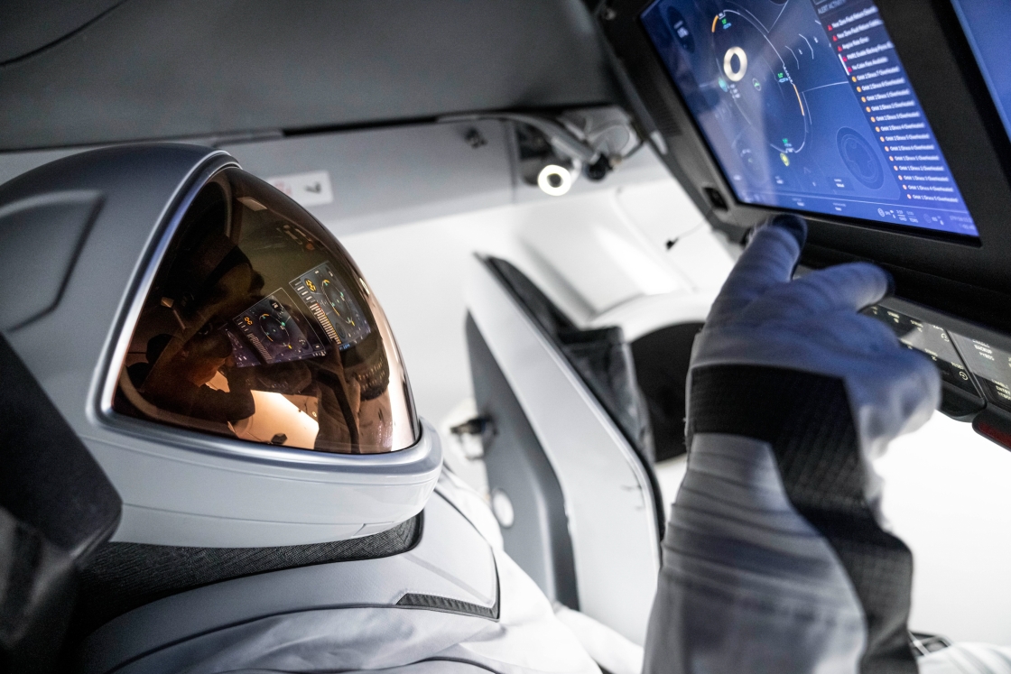 Astronaut in spaceship cockpit