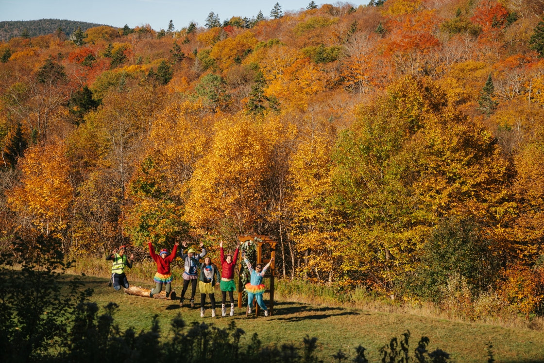 Group of students in front of foliage