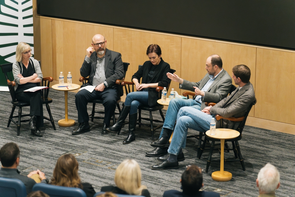 People participating in a panel discussion