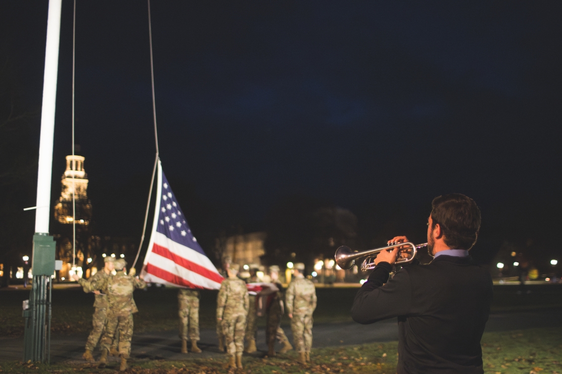 Dartmouth ROTC students next to the U.S. flag