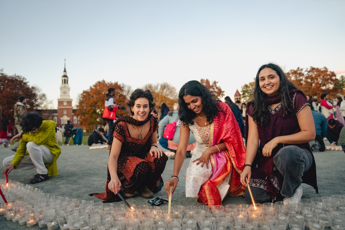 Women lighting candles