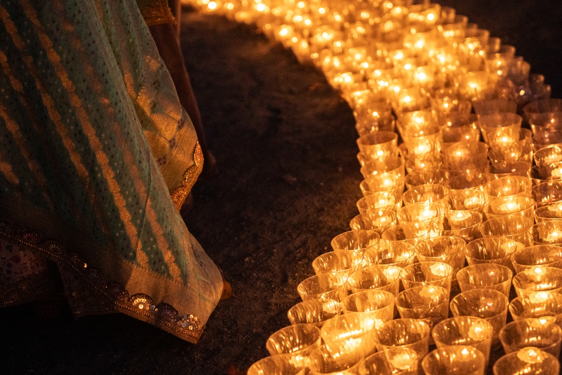 Warm orange arch of candles