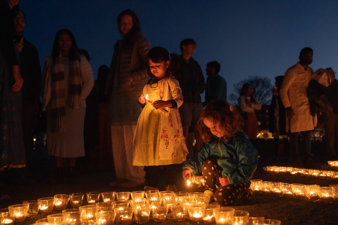 Children lighting candles