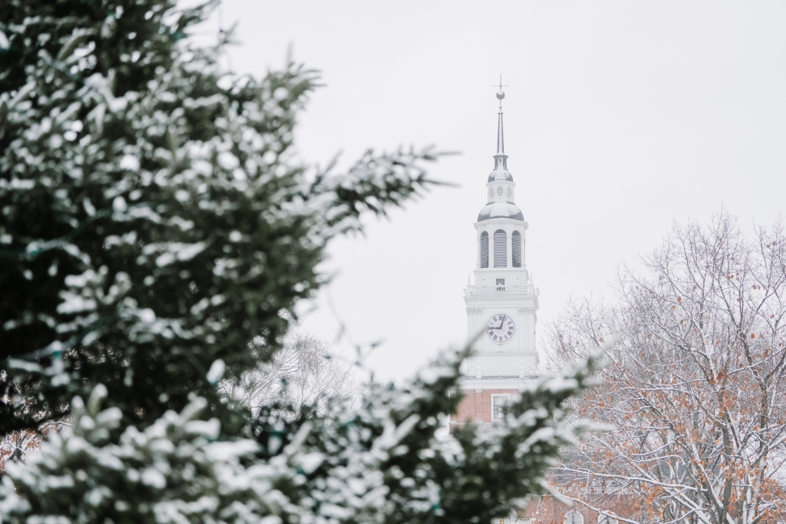 Snow covered Baker Tower behind a tree