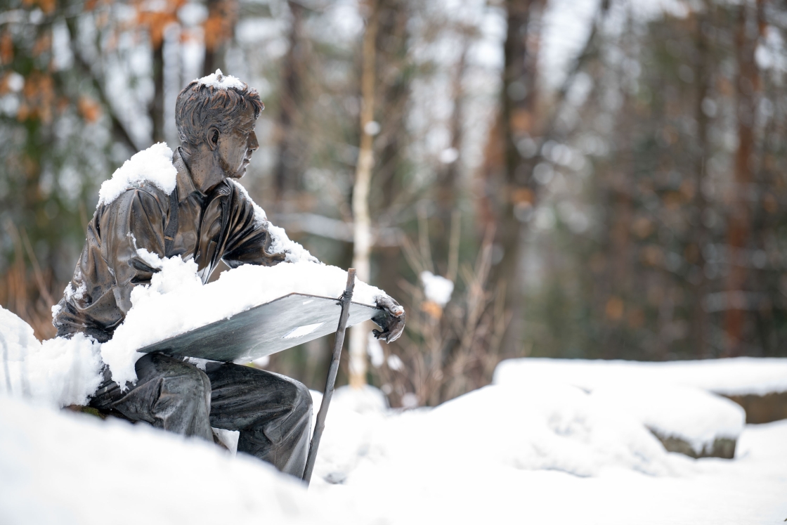 Robert Frost statue covered in snow