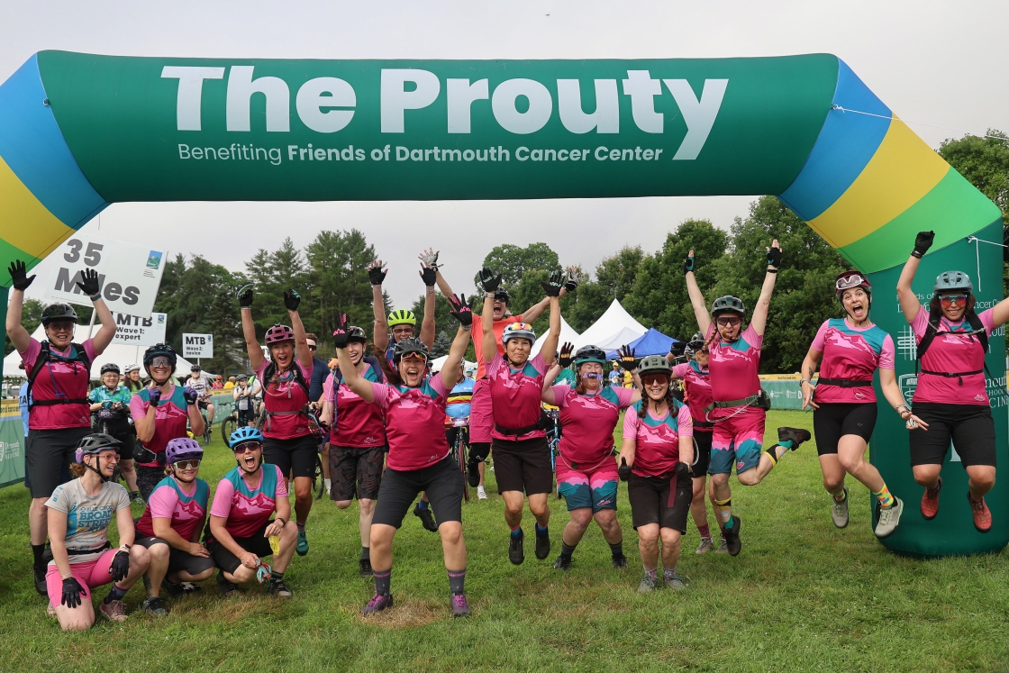 A group of cyclists celebrating at the Prouty finish line